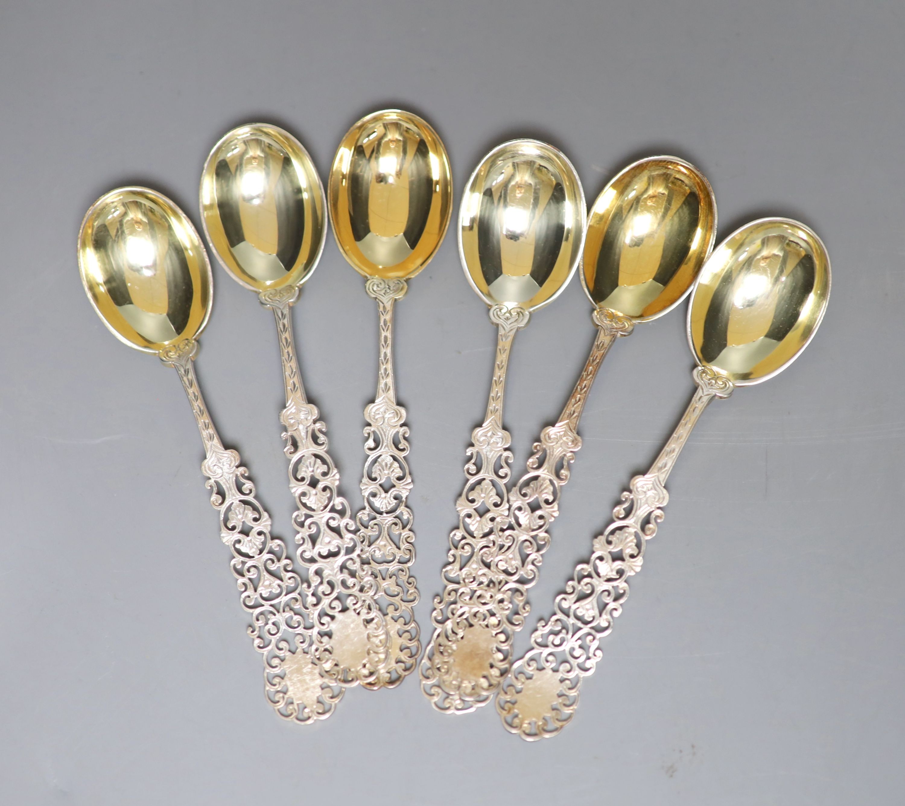 A set of six silver coffee spoons, with fancy pierced stems, Henry Howson, Sheffield, 1890, 11cm, 84 grams.